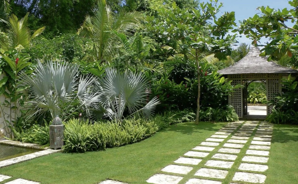 Beautifully designed tropical garden with gazebo in Florence-Graham, California